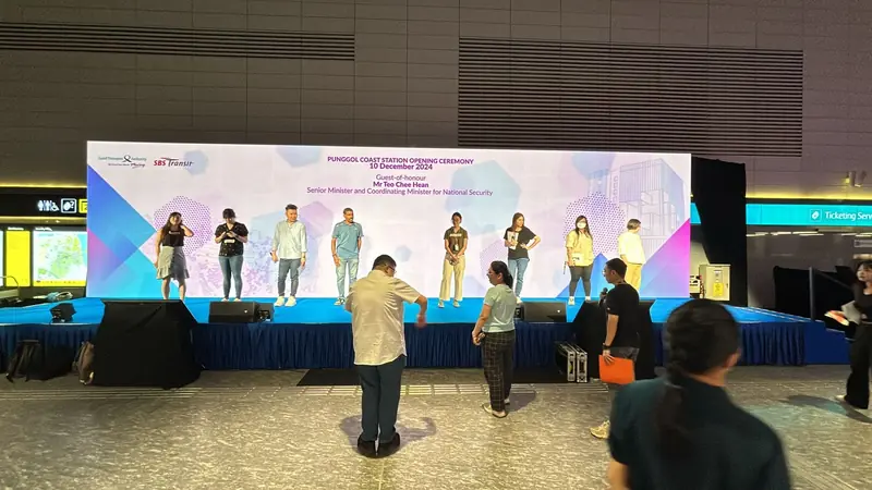 Stage rehearsal in front of a wide LED backdrop