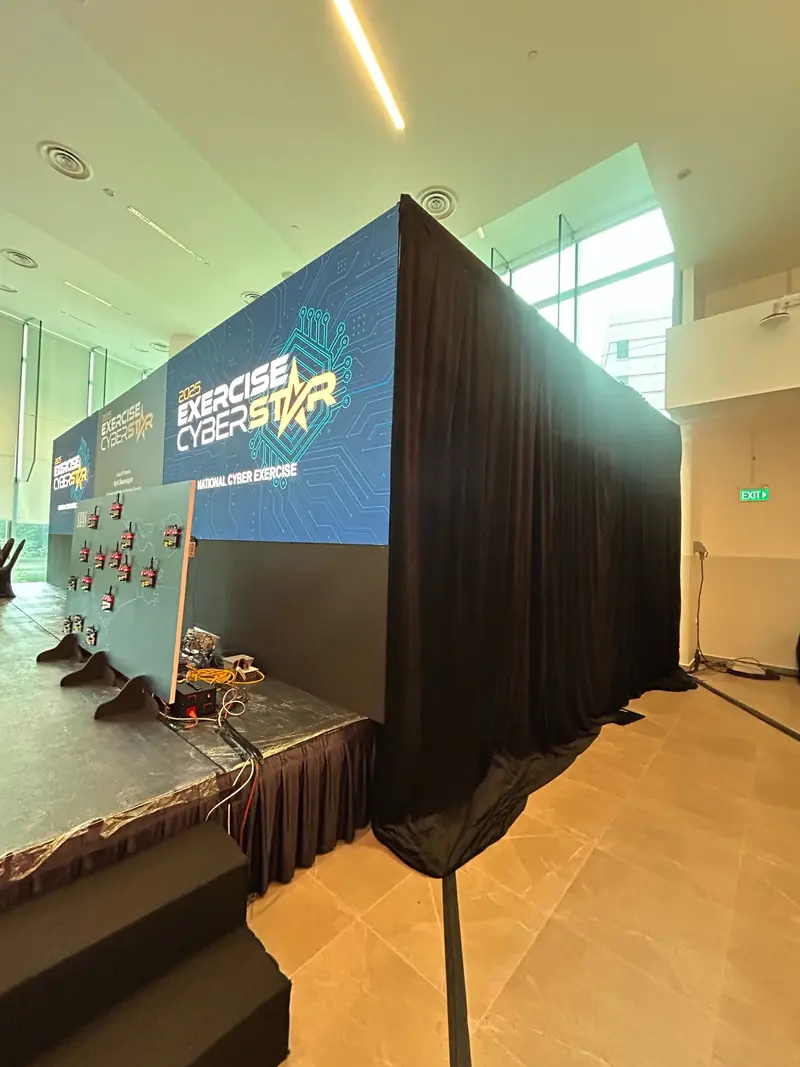 Freestanding LED wall framed with black drapes