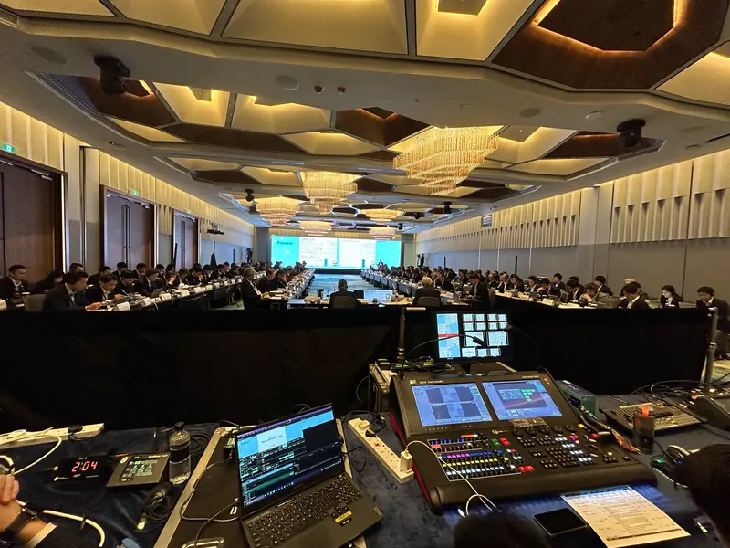 Digital mixing desk at the back of a ballroom conference