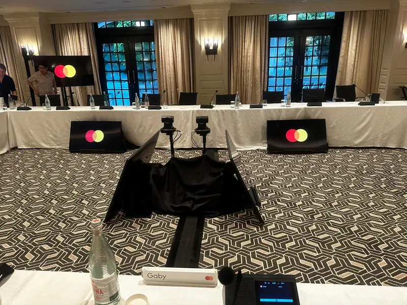 Hotel function room set for a round table meeting